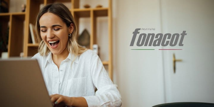 woman on notebook smiling